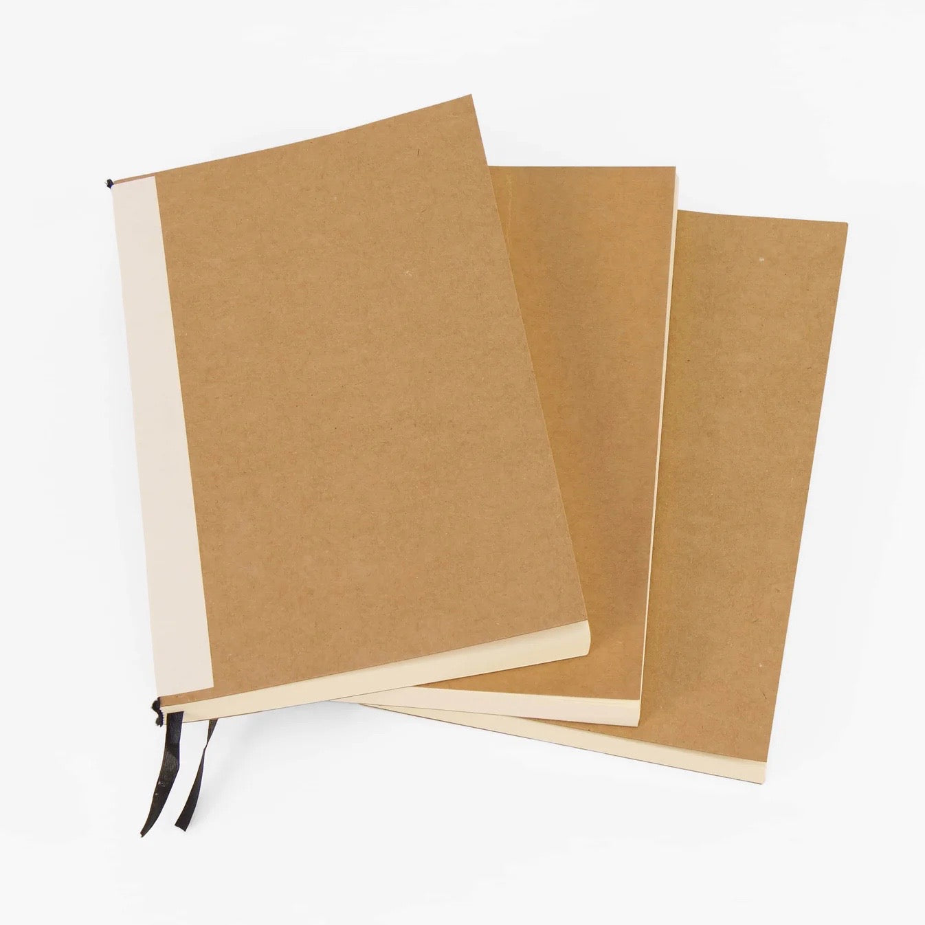 Three pack of kraft paper journal refills with cream pages
