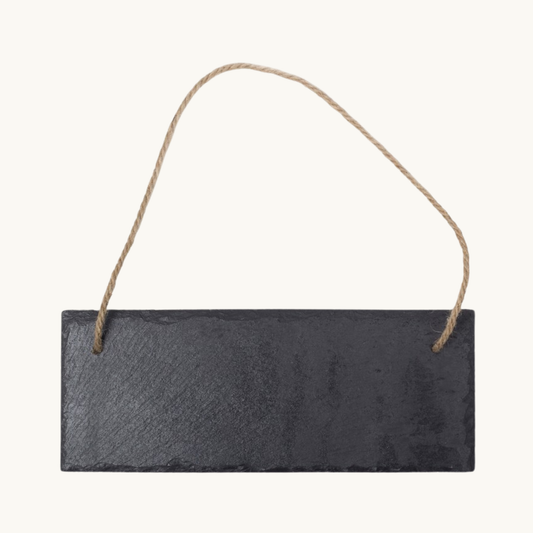 Personalized hanging slate sign on a warm neutral background