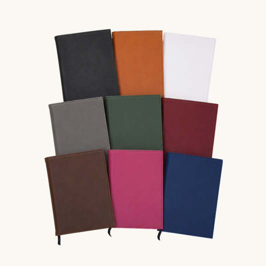 Leatherette notebook journals displayed in multiple colors