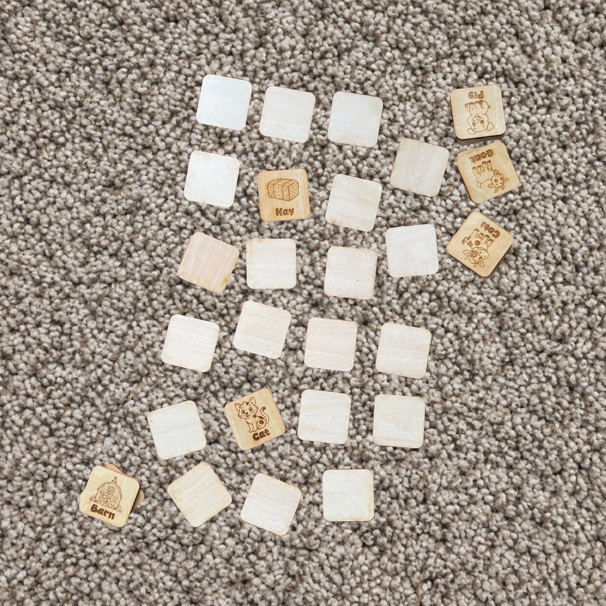 Engraved basswood tiles from the custom wooden memory matching game