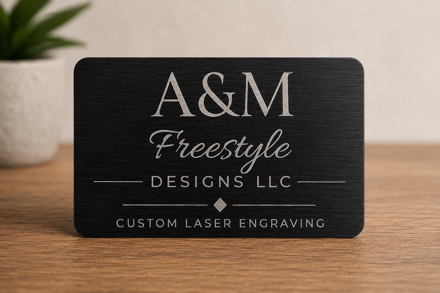 Front of custom engraved aluminum QR code card with A&M Freestyle Designs logo