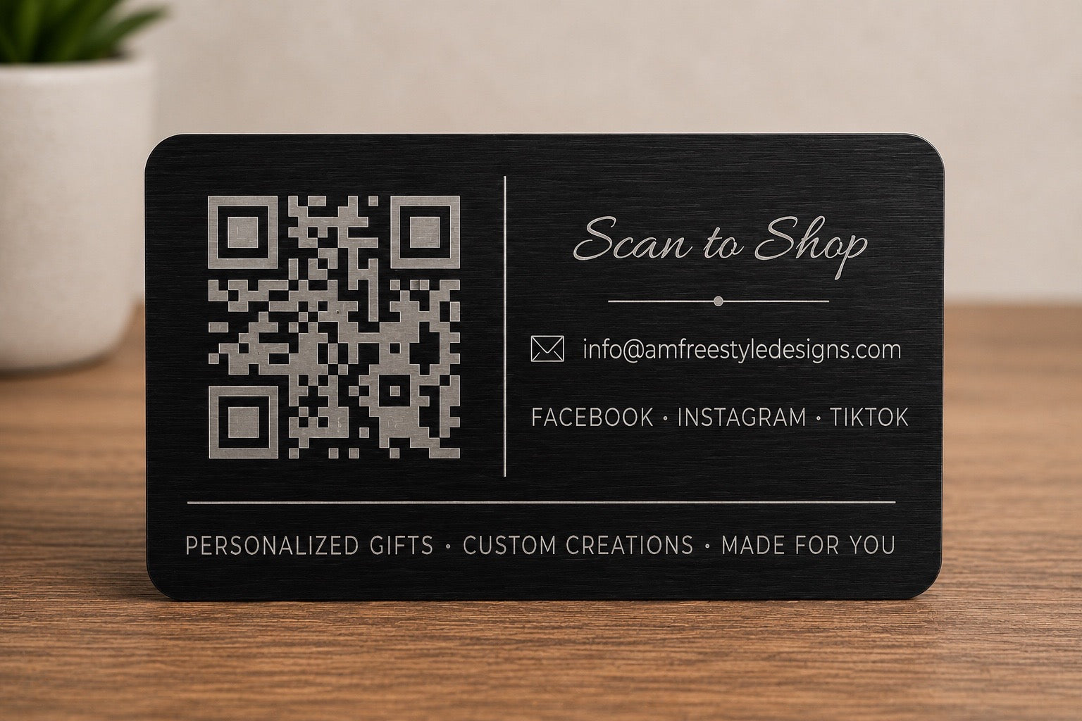 Back of custom engraved black stainless steel QR code card with scan to shop design