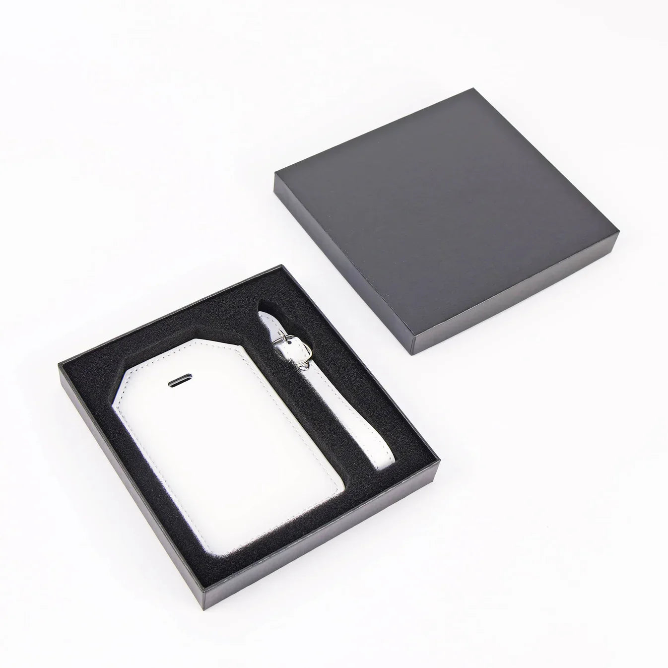 White custom engraved Laserette luggage tag with gift box